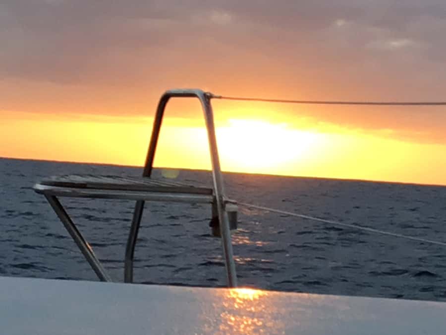 Grand Baie: Private 4-Hour Premium Sunset and Dinner Cruise - Sailing toward Coin de Mire and its sea cliffs