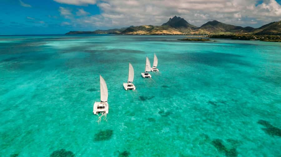 Ile Aux Cerfs: Catamaran Cruise, island, waterfalls, Lunch - Crew, languages, and overall atmosphere